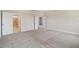 Spacious bedroom with plush carpeting and an ensuite bathroom at 5825 1/2 S 5Th St, Tampa, FL 33611