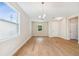 Bright dining room with hardwood floors and chandelier at 5825 1/2 S 5Th St, Tampa, FL 33611