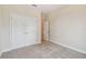 Bright bedroom with plush carpeting and double door closet at 5825 1/2 S 5Th St, Tampa, FL 33611