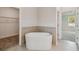 Bathroom boasts a free-standing tub and walk-in closet at 5825 1/2 S 5Th St, Tampa, FL 33611