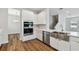 Bright kitchen with stainless steel appliances, a farmhouse sink, and an island at 5825 S 5Th St, Tampa, FL 33611