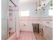 Pink tiled bathroom with shower and needs renovation at 603 Virginia Ave, Tarpon Springs, FL 34689