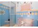 A bathroom with blue and yellow diamond-patterned tile, currently under renovation at 603 Virginia Ave, Tarpon Springs, FL 34689