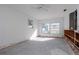 A living room under renovation, with exposed framing and flooring at 603 Virginia Ave, Tarpon Springs, FL 34689