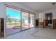 Living room with sliding glass doors to a patio at 603 Virginia Ave, Tarpon Springs, FL 34689