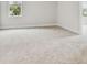 Bedroom featuring carpet flooring, white walls, baseboards, and trim at 609 N Bradford Ave, Tampa, FL 33609