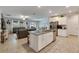 Modern kitchen with white cabinets, granite countertops, and stainless steel appliances at 7119 Paradise Island Ct, Sun City Center, FL 33573