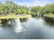 Community features a serene pond with a fountain and seating area at 760 Coral Reef Dr, Tampa, FL 33602