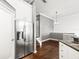 Modern kitchen features stainless steel appliances and dark hardwood floors at 760 Coral Reef Dr, Tampa, FL 33602
