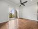 Spacious living room with hardwood floors and access to balcony at 760 Coral Reef Dr, Tampa, FL 33602