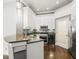 Modern kitchen with white cabinets, granite countertops and stainless steel appliances at 760 Coral Reef Dr, Tampa, FL 33602