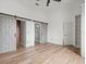 Bright bedroom with hardwood floors and barn door closets at 760 Coral Reef Dr, Tampa, FL 33602