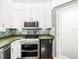 Modern kitchen with stainless steel appliances and granite counters at 760 Coral Reef Dr, Tampa, FL 33602