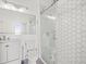 Modern bathroom with hexagon tile shower and white vanity at 760 Coral Reef Dr, Tampa, FL 33602
