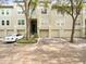 Townhouse with two-car garage and a spacious driveway in a lush setting at 760 Coral Reef Dr, Tampa, FL 33602