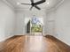 Living room with hardwood floors and access to balcony at 760 Coral Reef Dr, Tampa, FL 33602