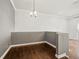 Bright dining room with hardwood floors and modern light fixture at 760 Coral Reef Dr, Tampa, FL 33602