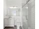 Modern bathroom with hexagon tile shower and white vanity at 760 Coral Reef Dr, Tampa, FL 33602
