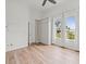 Bedroom with hardwood floors, built-in cabinets and water views at 760 Coral Reef Dr, Tampa, FL 33602