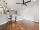 Open living area with hardwood floors and kitchen view at 760 Coral Reef Dr, Tampa, FL 33602