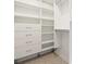 Bright walk-in closet with shelves and hanging rods at 760 Coral Reef Dr, Tampa, FL 33602