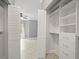 Large walk-in closet with built-in shelving and drawers at 760 Coral Reef Dr, Tampa, FL 33602