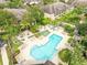Community pool with surrounding lounge chairs and landscaping at 760 Coral Reef Dr, Tampa, FL 33602