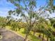 Landscaped grounds with lush greenery and mature trees at 760 Coral Reef Dr, Tampa, FL 33602