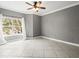 Bedroom with tile floors, neutral walls, and large window at 760 Coral Reef Dr, Tampa, FL 33602