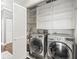 Convenient laundry room with washer, dryer, and shelving at 760 Coral Reef Dr, Tampa, FL 33602