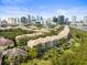 Community overview with city skyline in the background at 760 Coral Reef Dr, Tampa, FL 33602