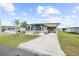Single-Gathering home with carport and landscaped yard at 35209 Ada Ave, Zephyrhills, FL 33541
