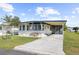 Single-Gathering home with carport and landscaped yard at 35209 Ada Ave, Zephyrhills, FL 33541