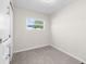 Simple bedroom with carpet flooring and a double door closet at 35209 Ada Ave, Zephyrhills, FL 33541