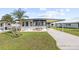 Single-Gathering home with carport and landscaped yard at 35209 Ada Ave, Zephyrhills, FL 33541