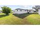 Spacious backyard with grass and storage shed at 35209 Ada Ave, Zephyrhills, FL 33541