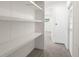 Bright pantry with ample shelving, offering convenient storage solutions at 35209 Ada Ave, Zephyrhills, FL 33541