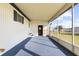 Spacious screened porch with blue carpeting, offering a relaxing outdoor space at 35209 Ada Ave, Zephyrhills, FL 33541