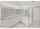 Modern bathroom with double vanity and granite countertops at 103 Mariner Dr, Tarpon Springs, FL 34689