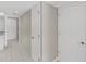 Clean hallway with tile flooring and storage at 103 Mariner Dr, Tarpon Springs, FL 34689