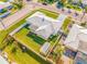 Aerial view of the property showing a spacious layout, well-manicured lawn, fenced yard, and convenient neighborhood access at 11211 60Th Ave, Seminole, FL 33772