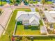 Aerial view of a well-maintained property with lush green lawn, fenced yard, and a prime location in a quiet neighborhood at 11211 60Th Ave, Seminole, FL 33772