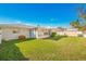Lush backyard featuring a well-maintained lawn and partial view of the sunroom and the property's fence at 11211 60Th Ave, Seminole, FL 33772