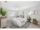 Comfortable bedroom featuring a decorative rug, ceiling fan, and neutral decor at 11211 60Th Ave, Seminole, FL 33772