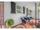 Inviting front porch with decorative chairs and terracotta tile flooring at 11211 60Th Ave, Seminole, FL 33772