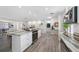 Open kitchen with an island, modern appliances, and sightlines into the living area at 11211 60Th Ave, Seminole, FL 33772