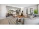 Open-concept living room with neutral paint, lots of natural light, and comfortable furniture at 11211 60Th Ave, Seminole, FL 33772