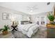 Cozy main bedroom featuring a ceiling fan, windows, and a decorative rug at 11211 60Th Ave, Seminole, FL 33772