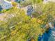 Aerial view of townhouse community with pool and lush landscaping at 13122 Thoroughbred Loop, Largo, FL 33773