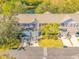 An aerial view of the townhome, highlighting its exterior and landscaping at 13122 Thoroughbred Loop, Largo, FL 33773